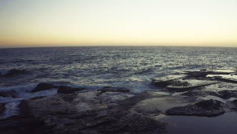coastal sunset/sunrise over rocky shore