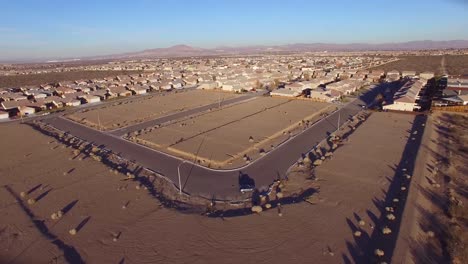 aerial over desert reveals housing tracts and empty lots in the desert 1