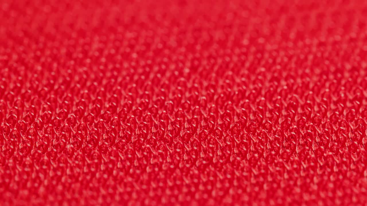 close-up macro view of red velcro surface with micro hooks