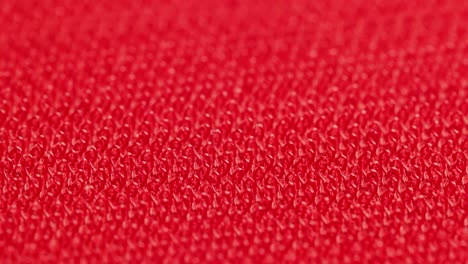 close-up macro view of red velcro surface with micro hooks