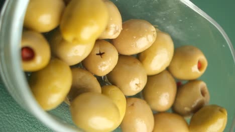 green olives in a glass bowl
