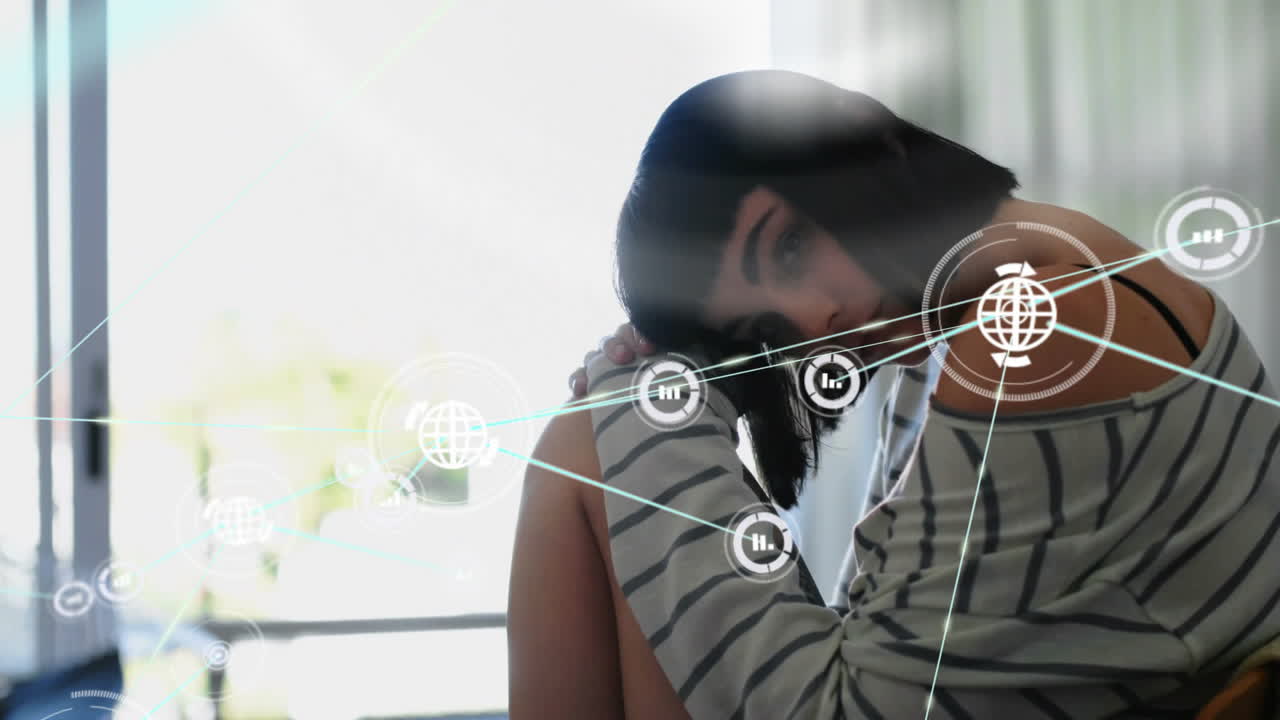 animación de la red de conexiones con iconos sobre mujer caucásica sentada en una silla