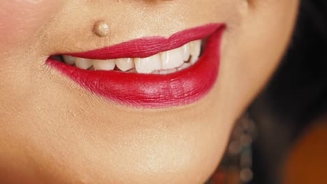 woman with red lipstick and a smile