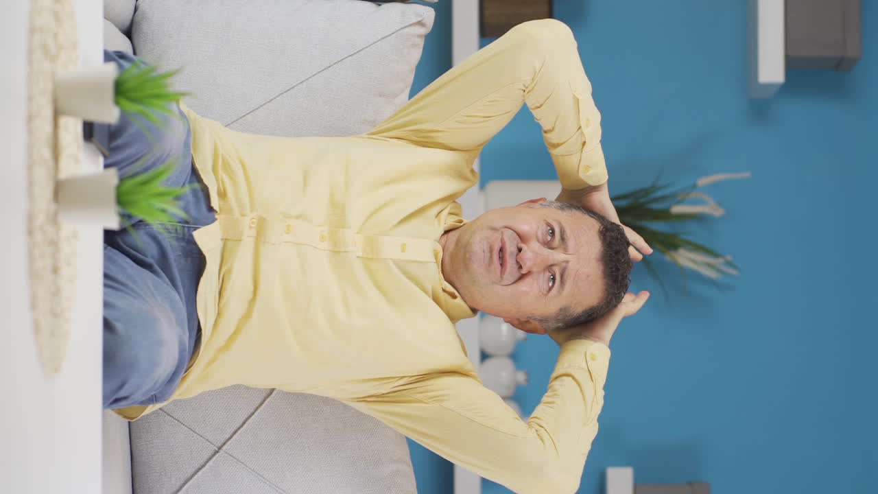 Vertical video of The old man who doesn't feel well.