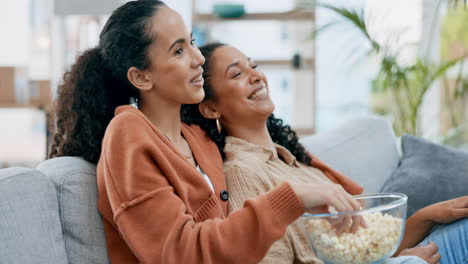 Watching-tv,-popcorn-and-a-lesbian-couple-laughing
