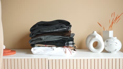 Stack-of-clothes-on-table-indoor