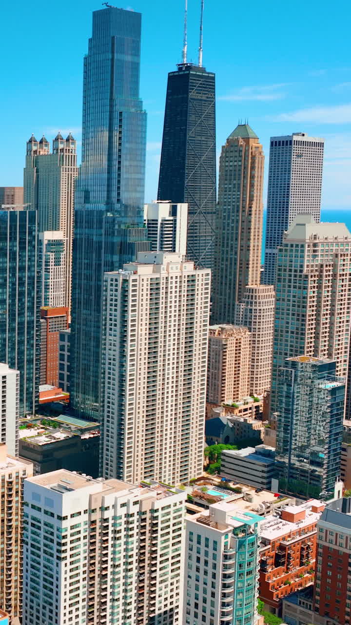 Skyscrapers cityscape downtown, Chicago skyline buildings. Beautiful real estate. Day time. Empty rooftop. Vertical video