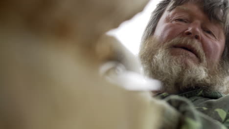 elderly woodcarver at work