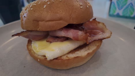 bacon and egg roll for breakfast. zoom in.
