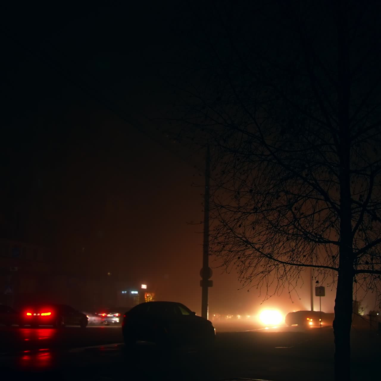 City in darkness at the time of blackout. Ukrainian reality after russian attacks on power plants. Traffic by the roads at night time