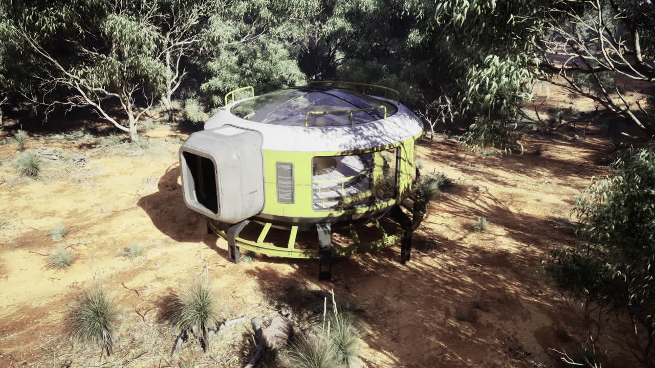 Unique futuristic habitat located in a dense forest setting surrounded by trees