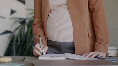 pregnant woman working in office