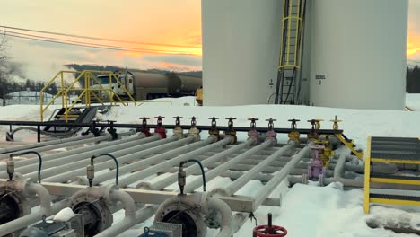 a cold winter morning reveals the plumbing and pumps at a bulk fuel facility