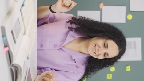 Vertical-video-of-Happy-Female-student-dancing.