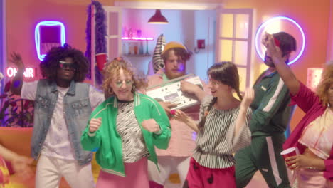 group of friends dancing at a retro party