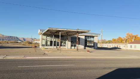 an abandoned one-story building by the roadside.