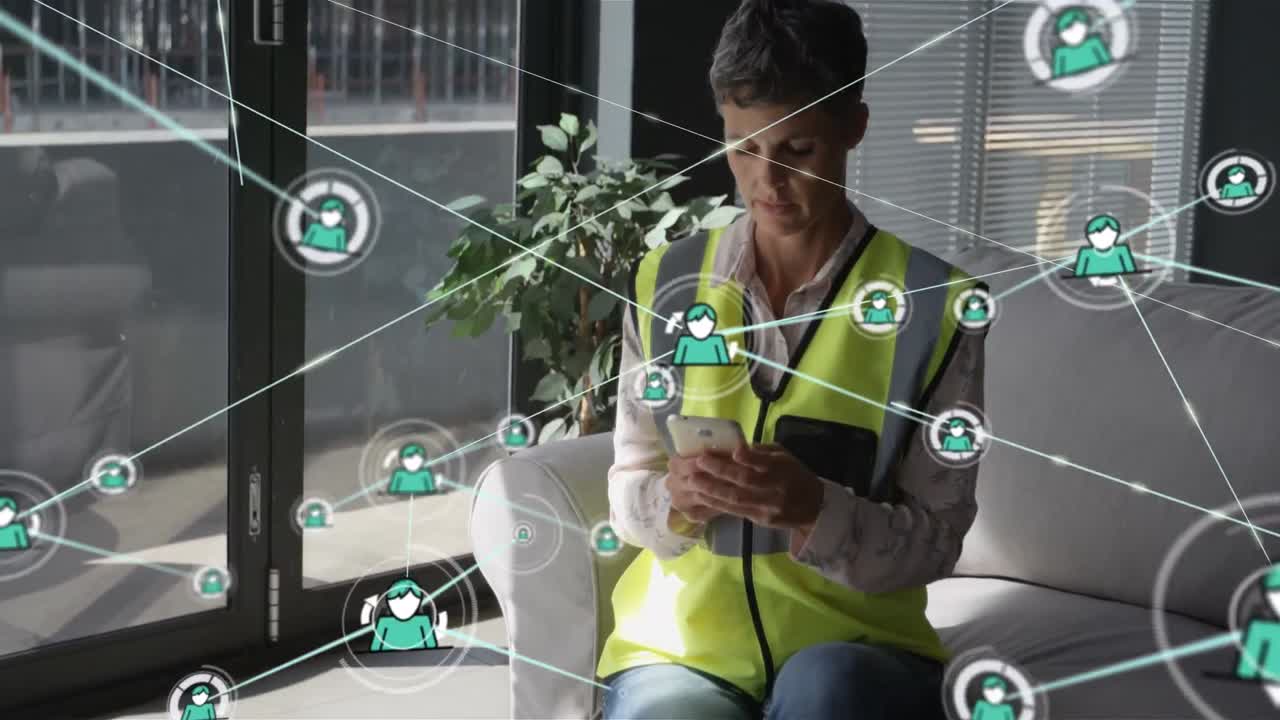 Animation of network of connections with icons over caucasian female architect using smartphone