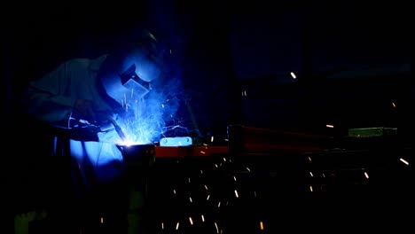 metalsmith using welding torch in workshop 4k