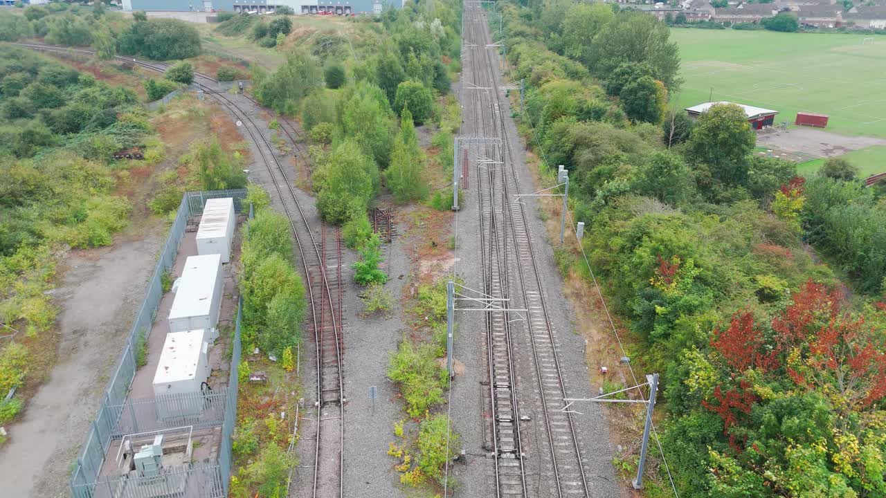 Aerial View of Railway Tracks and Surrounding Landscape