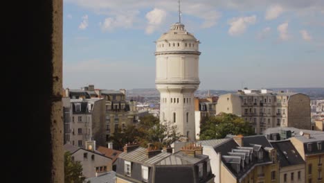 view of paris and the water tower of montmartre from the dome of basilica of the sacred heart in montmartre paris