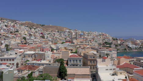 Aerial:-Panoramic-drone-shot-of-Ermoupoli-and-Agios-Nikolaos-Chruch-in-Syros,-Greece