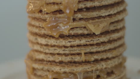 tilt up of delicious stack of stroopwafels, a typical dutch cookie - extreme close