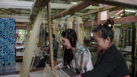 women weaving traditional textiles