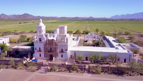 a beautiful aerial establishing shot of mission san xavier del bac a historic spanish catholic mission near tucson arizona