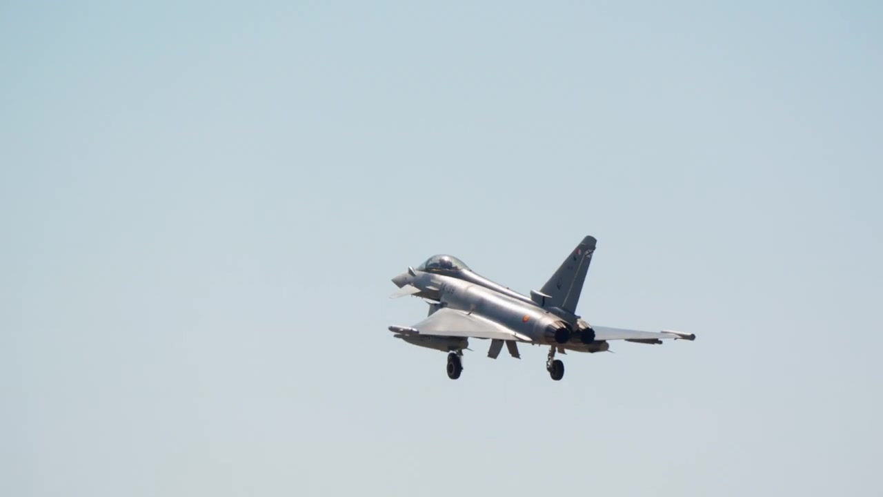 Military jet on final approach seen head on