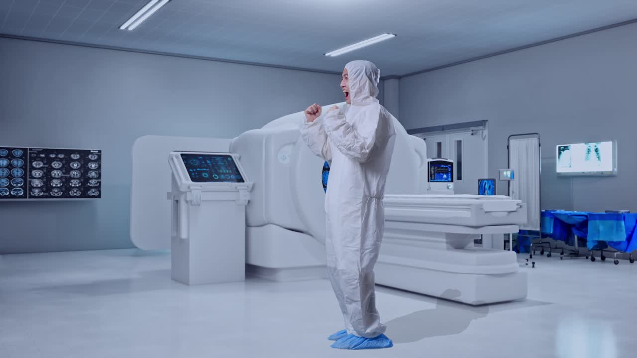 Full Body Side View Of Asian Male Scientist Celebrating The Succeed While Standing With MRI Machine In The Hospital