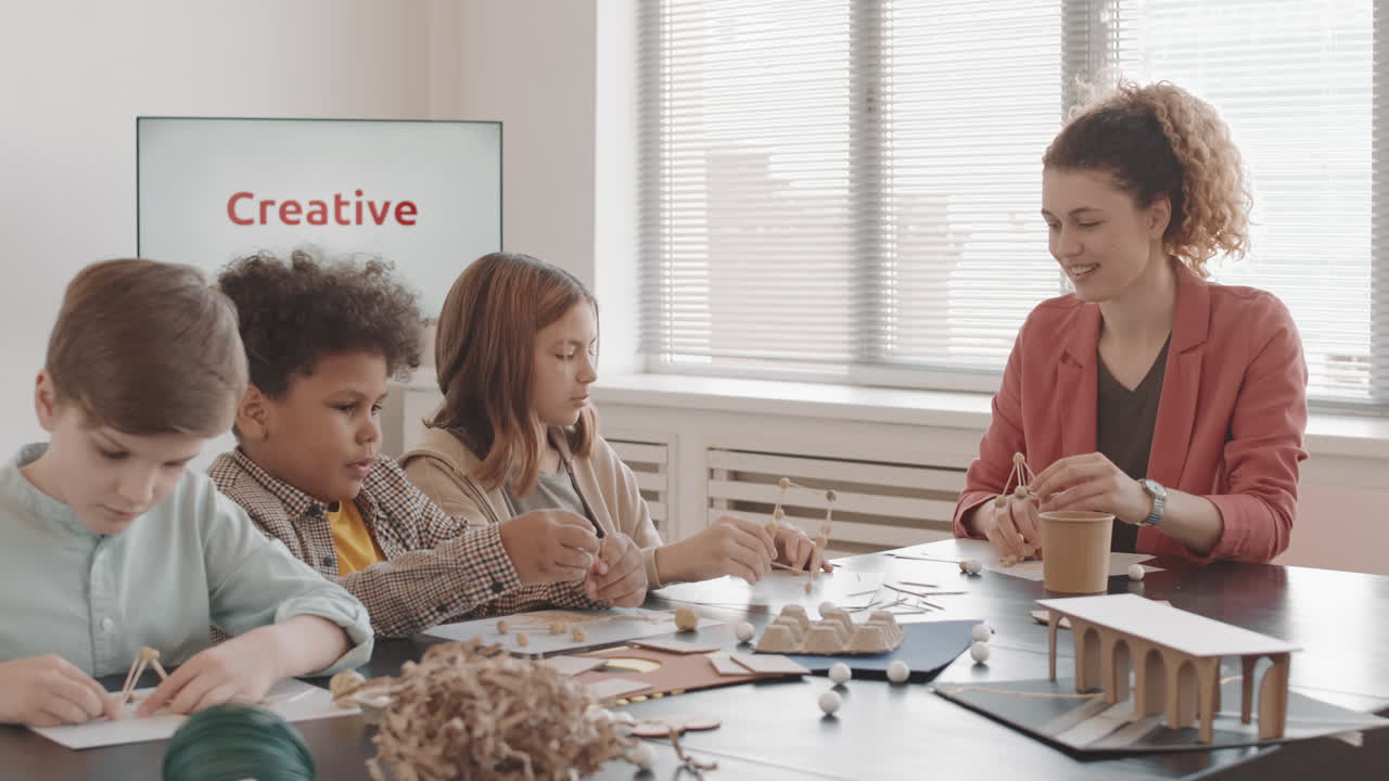 Diverse Children Making Crafts with Teacher