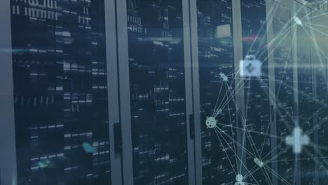 animation of spinning globe of medical icons and mosaic squares against computer server room