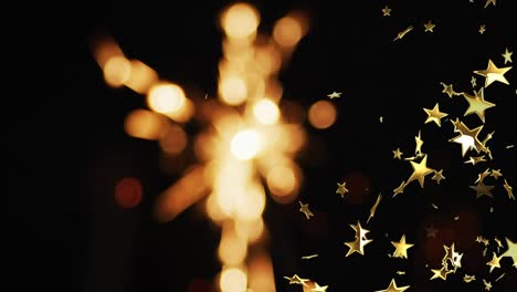 Animation-of-sparkler-and-stars-on-black-background