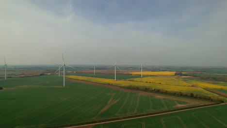 wind turbine renewable green energy farm in yorkshire, uk - aerial drone shot