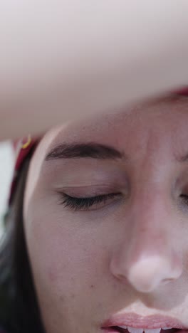 Vertical-close-up-of-caucasian-female-face-open-and-close-eyes,-Mallorca