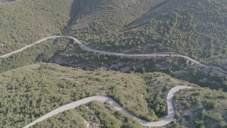 aerial side movement shot of mountain road