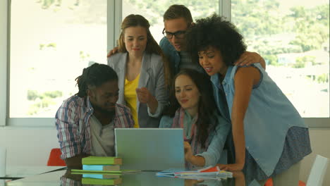 Students-looking-at-laptop-together