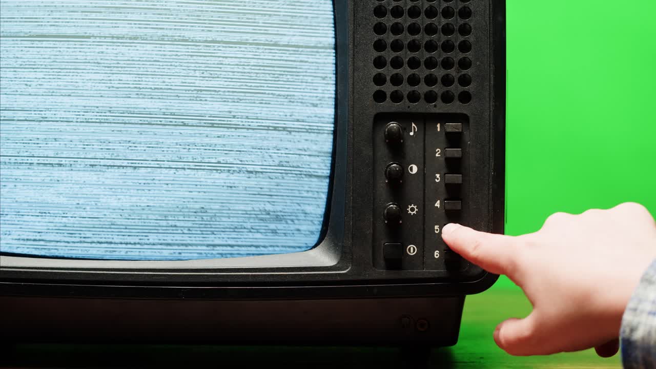Retro Style TV Set with Green Screen chroma key background, vintage 60s analog television with grain and noise.
