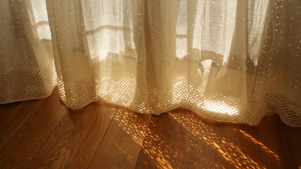 Swaying sheer curtain casting dotted light across wood floor at home, soft breeze shifting muntins