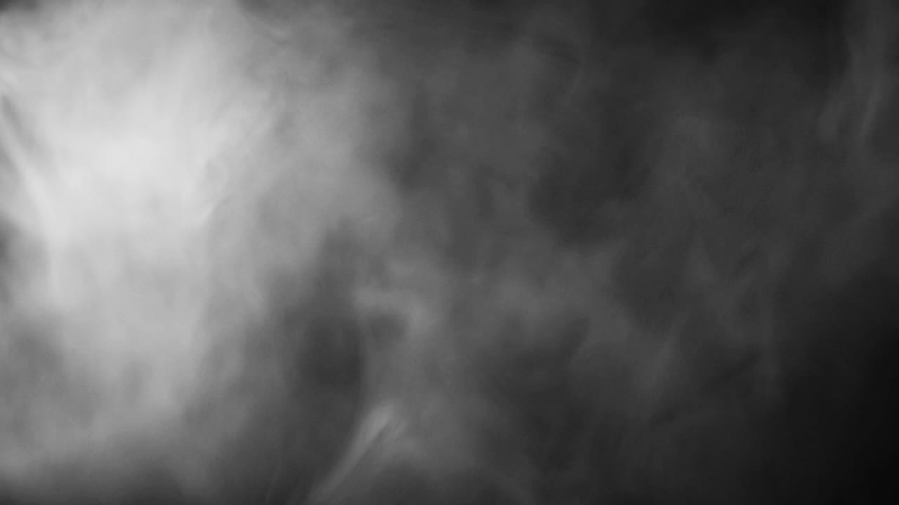 Dense White Smoke Spreading and Dissipating on Black