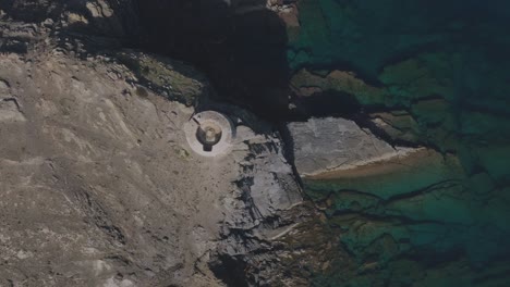 Viewpoint-in-Coastal-Menorca-Blue-Sea-Rocky-Cliff-Shore-Aerial-The-Mirador-D'es-Colomer-panoramic-views-natural-beauty-Drone-Top-Down-View