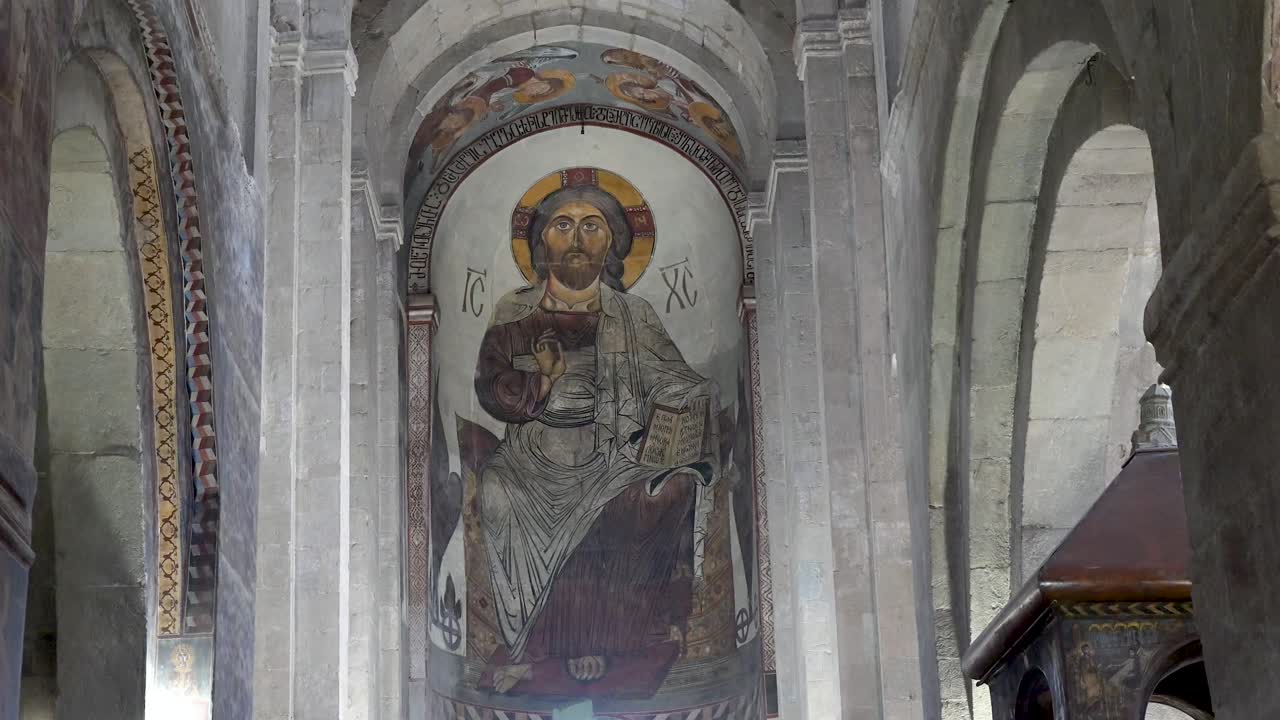 Fresco of Jesus Christ inside Svetitskhoveli Cathedral in Georgia, showing detailed Christian artwork and historic religious tradition on the ancient stone wall