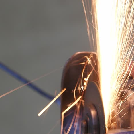 construction worker using an angle grinder