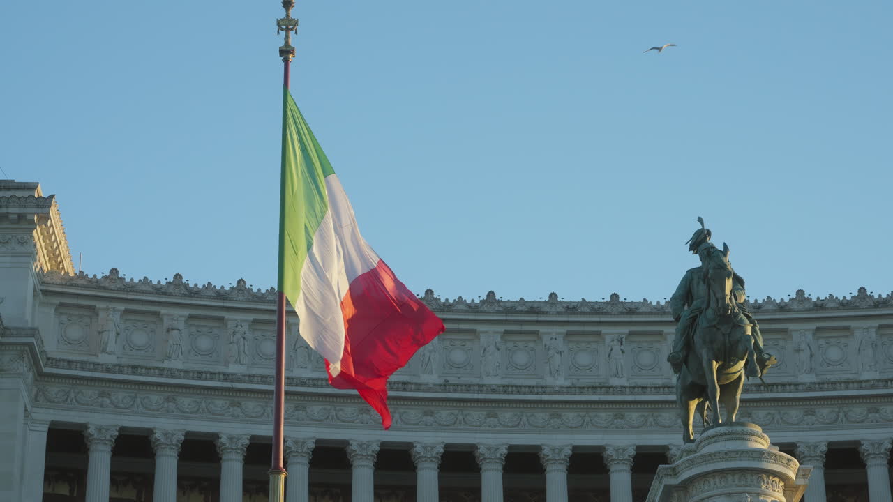 National Monument to
​King Victor Emmanuel II, flag waving in slow motion next to the King's statue