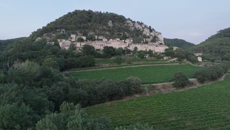 aerial drone shot vaucluse provence seguret medieval town vineyards sunset france