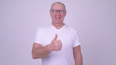 studio shot of handsome senior man