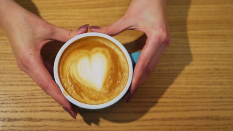 freshly made coffee from professional barista. barista serving cup of coffee on the bar to guest
