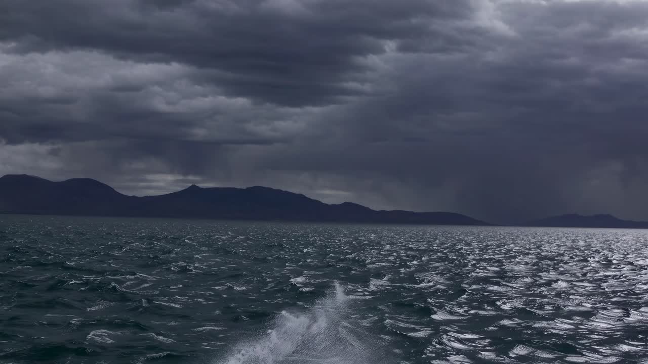 Dramatic seascape video with a low-angle view of choppy waters under a stormy sky