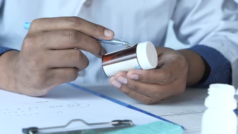 doctor examining prescription medicine