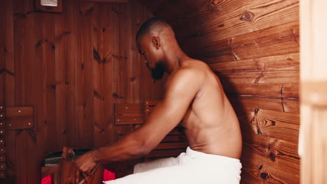 man in a wooden sauna